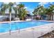 Large swimming pool surrounded by lush landscaping at 813 Heron Pl, Winter Haven, FL 33884