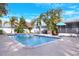 Resort-style pool with tropical landscaping at 813 Heron Pl, Winter Haven, FL 33884