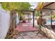 Brick paved poolside patio walkway next to a screen enclosure at 813 Heron Pl, Winter Haven, FL 33884