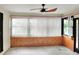 Sunroom with wood paneling and neutral colors at 813 Heron Pl, Winter Haven, FL 33884