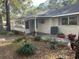 Backyard with patio, landscaping, and AC unit at 8655 Sw 98Th Street Rd # A, Ocala, FL 34481