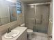 Clean bathroom featuring a shower and tub combo, updated vanity, and mirrored medicine cabinet at 8655 Sw 98Th Street Rd # A, Ocala, FL 34481