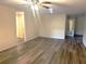 Spacious living room featuring wood-look floors and a ceiling fan at 8655 Sw 98Th Street Rd # A, Ocala, FL 34481