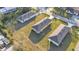 Three new houses on a grassy lot at 1029 Lakewood Ct, Lakeland, FL 33801