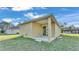 Newly built home with covered patio and grassy backyard at 1029 Lakewood Ct, Lakeland, FL 33801