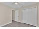 Bedroom with double door closet and vinyl flooring at 1029 Lakewood Ct, Lakeland, FL 33801