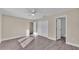 Bedroom with double door closet, ensuite bathroom, and wood-look flooring at 1029 Lakewood Ct, Lakeland, FL 33801