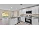 Kitchen with island, stainless steel appliances, and granite countertops at 1029 Lakewood Ct, Lakeland, FL 33801