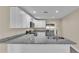 Modern kitchen features stainless steel appliances and granite countertops at 1029 Lakewood Ct, Lakeland, FL 33801