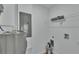 Laundry area with water heater, electrical panel and shelving at 1029 Lakewood Ct, Lakeland, FL 33801