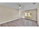Bright living room with a ceiling fan and large windows at 1029 Lakewood Ct, Lakeland, FL 33801