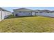 Well-maintained backyard with lush green grass and a white fence, providing a secure outdoor space at 1065 Silas St, Haines City, FL 33844