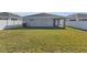 Expansive backyard with green grass and privacy fence, ideal for outdoor activities at 1065 Silas St, Haines City, FL 33844