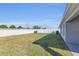 Spacious backyard featuring lush green grass and a privacy fence at 1065 Silas St, Haines City, FL 33844