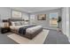 A spacious bedroom features a king bed, neutral color scheme, and natural lighting at 1065 Silas St, Haines City, FL 33844