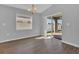 Dining area with wood-look floors, natural light and sliding glass door to the backyard at 1065 Silas St, Haines City, FL 33844