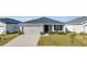 Charming one-story home with well-kept lawn, an attached garage, and inviting curb appeal at 1065 Silas St, Haines City, FL 33844