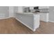 Kitchen featuring a large island with sink and stainless steel appliances at 1065 Silas St, Haines City, FL 33844
