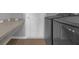 Laundry room with modern washer and dryer, countertop for folding, and wood-look flooring at 1065 Silas St, Haines City, FL 33844