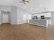 Bright, open-concept living area leading to a modern kitchen with a center island, perfect for entertaining at 1065 Silas St, Haines City, FL 33844