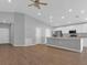 Open-concept layout showcases a spacious living area connected to a modern kitchen with island at 1065 Silas St, Haines City, FL 33844