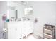 Double vanity bathroom with modern finishes at 1074 Berkeley Dr, Kissimmee, FL 34744