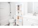 Bathroom with shower, toilet, vanity, and white shelving at 1074 Berkeley Dr, Kissimmee, FL 34744