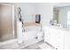 Bathroom with soaking tub, shower, and double vanity at 1074 Berkeley Dr, Kissimmee, FL 34744