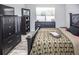 Spacious bedroom with a king-size bed and ample storage at 1074 Berkeley Dr, Kissimmee, FL 34744
