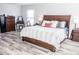 Large bedroom with king bed and wood furniture at 1074 Berkeley Dr, Kissimmee, FL 34744