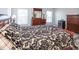 Main bedroom with wood floors, large bed, and ample storage at 1074 Berkeley Dr, Kissimmee, FL 34744