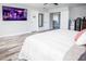 Bedroom with large TV and king-size bed at 1074 Berkeley Dr, Kissimmee, FL 34744