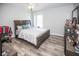 Spacious bedroom with large bed, dresser, and wood-look floors at 1074 Berkeley Dr, Kissimmee, FL 34744