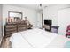 Bedroom with queen bed, dresser, and wood-look floors at 1074 Berkeley Dr, Kissimmee, FL 34744