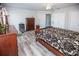 Spacious bedroom with wood flooring and large bed at 1074 Berkeley Dr, Kissimmee, FL 34744