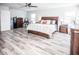 Primary bedroom with king bed and large TV at 1074 Berkeley Dr, Kissimmee, FL 34744