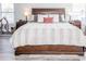 King bed with fluffy bedding in a bright room at 1074 Berkeley Dr, Kissimmee, FL 34744