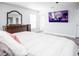 Bedroom with large TV and dresser at 1074 Berkeley Dr, Kissimmee, FL 34744