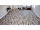 Spacious bonus room with wood-look tile floors and ample natural light at 1074 Berkeley Dr, Kissimmee, FL 34744