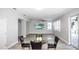 Spacious dining area with glass top table and access to patio at 1074 Berkeley Dr, Kissimmee, FL 34744