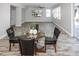 Dining area with glass table and leather chairs, near kitchen at 1074 Berkeley Dr, Kissimmee, FL 34744