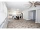 Open concept dining area with view into kitchen and living room at 1074 Berkeley Dr, Kissimmee, FL 34744