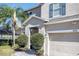 Two-story house with gray siding, gray shutters, and a two-car garage at 1074 Berkeley Dr, Kissimmee, FL 34744