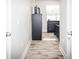 Bright hallway with wood-look tile flooring at 1074 Berkeley Dr, Kissimmee, FL 34744