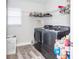 Laundry room with washer, dryer, and storage at 1074 Berkeley Dr, Kissimmee, FL 34744