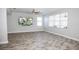 Bright living room with tile floors and sliding glass doors leading to patio at 1074 Berkeley Dr, Kissimmee, FL 34744