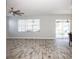 Living room with tile floor, sliding glass doors, and pool view at 1074 Berkeley Dr, Kissimmee, FL 34744