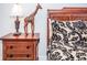 Wooden nightstand with lamp and decorative giraffe at 1074 Berkeley Dr, Kissimmee, FL 34744