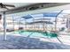 Inviting pool area with screened enclosure, spa, and patio at 1074 Berkeley Dr, Kissimmee, FL 34744