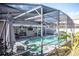 Screened-in pool and spa with paver deck and lounge chairs at 1074 Berkeley Dr, Kissimmee, FL 34744